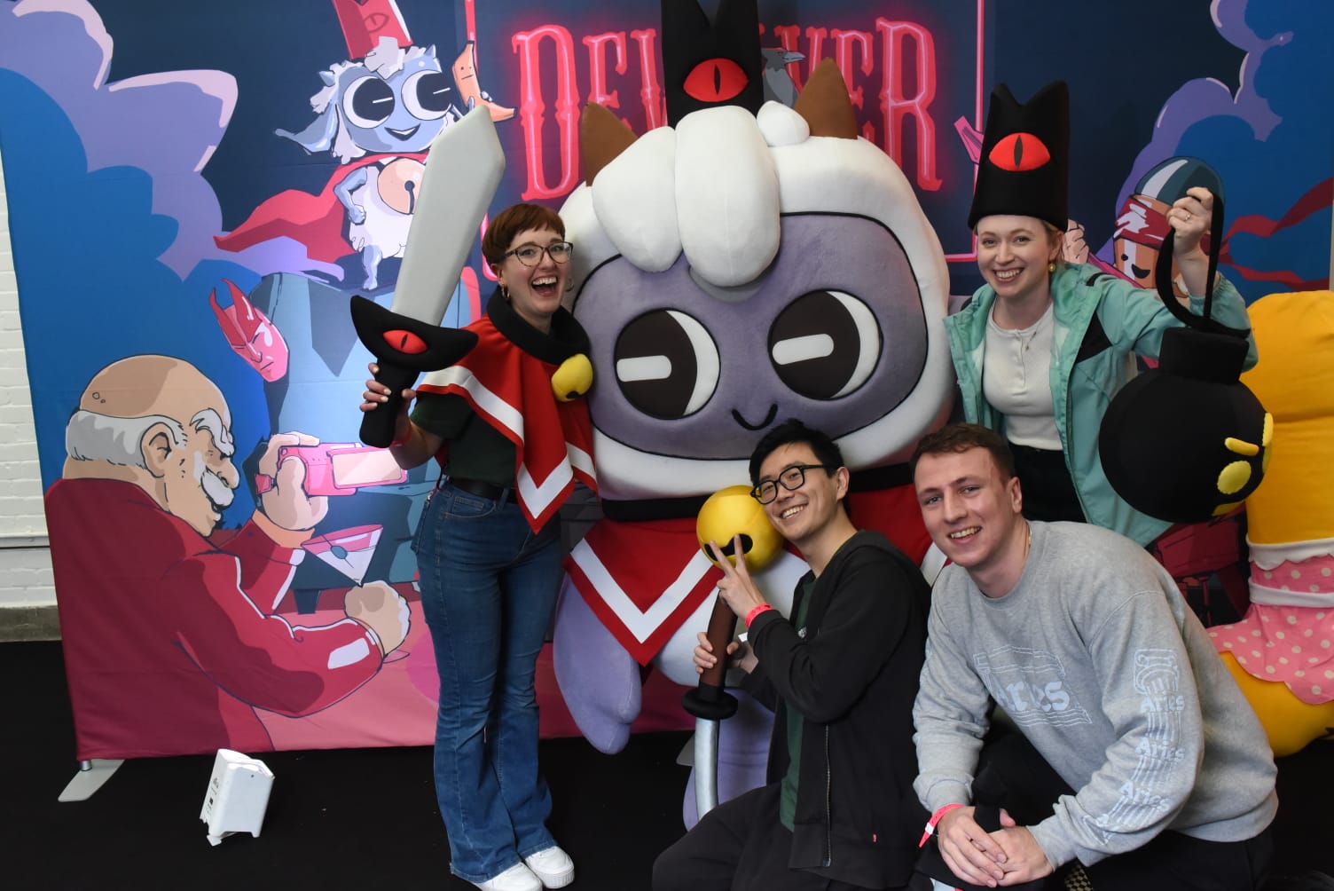 The Ukie Education team make friends with The Lamb at the Devolver Digital stand at WASD in March 2023